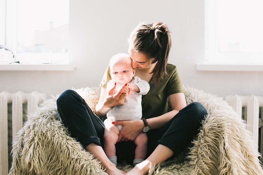 woman holding baby adult-affection-baby